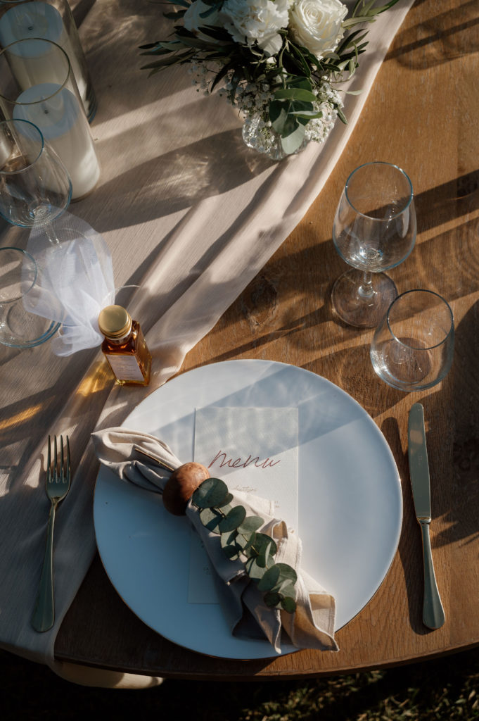 Elegant castle reception table with gold accents and vineyard views at Athens wedding