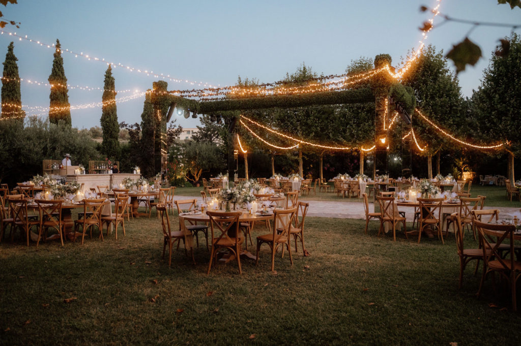 Reception night view with fairy lights at romantic castle wedding in Athens