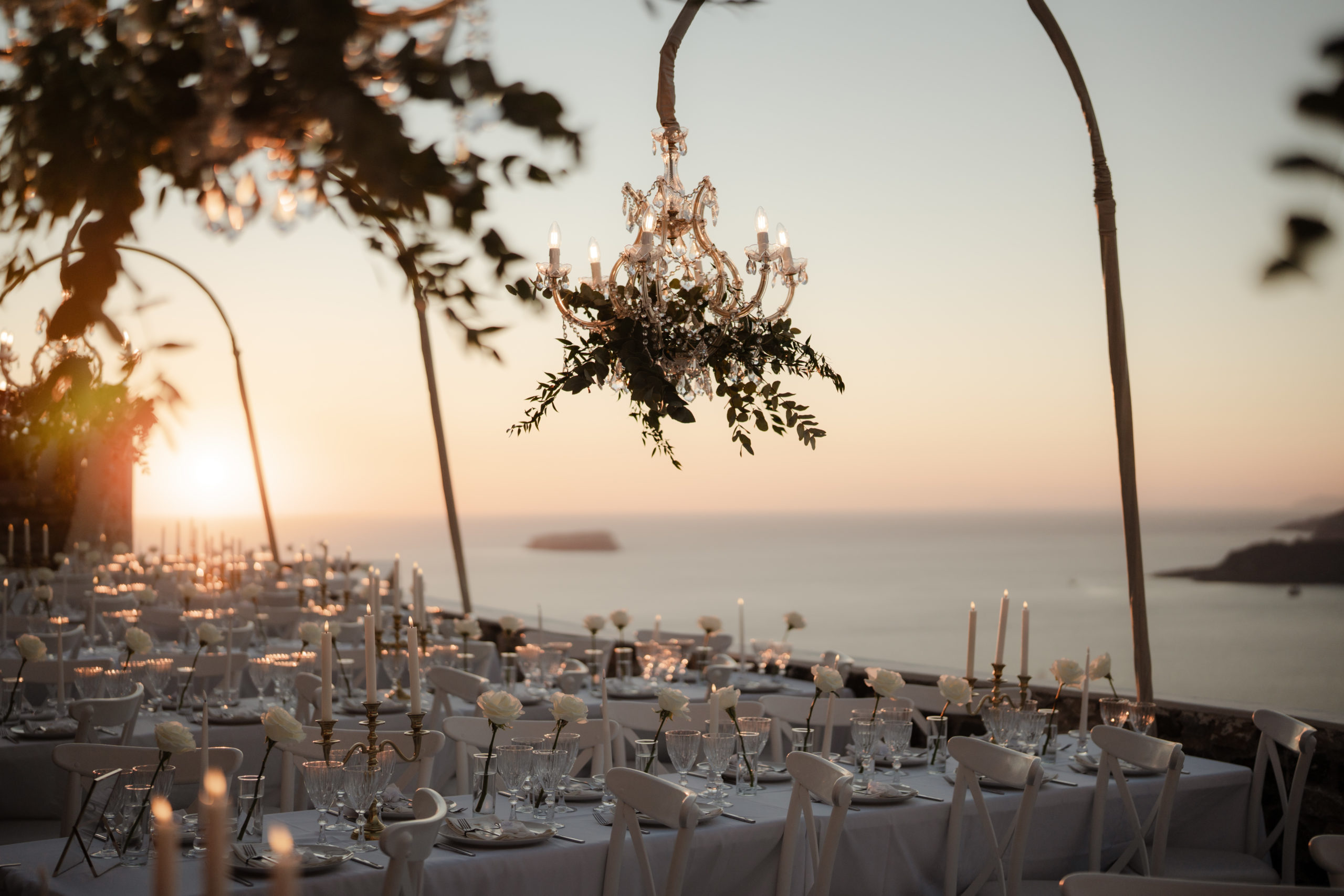 Santorini cliffside wedding with romantic florals